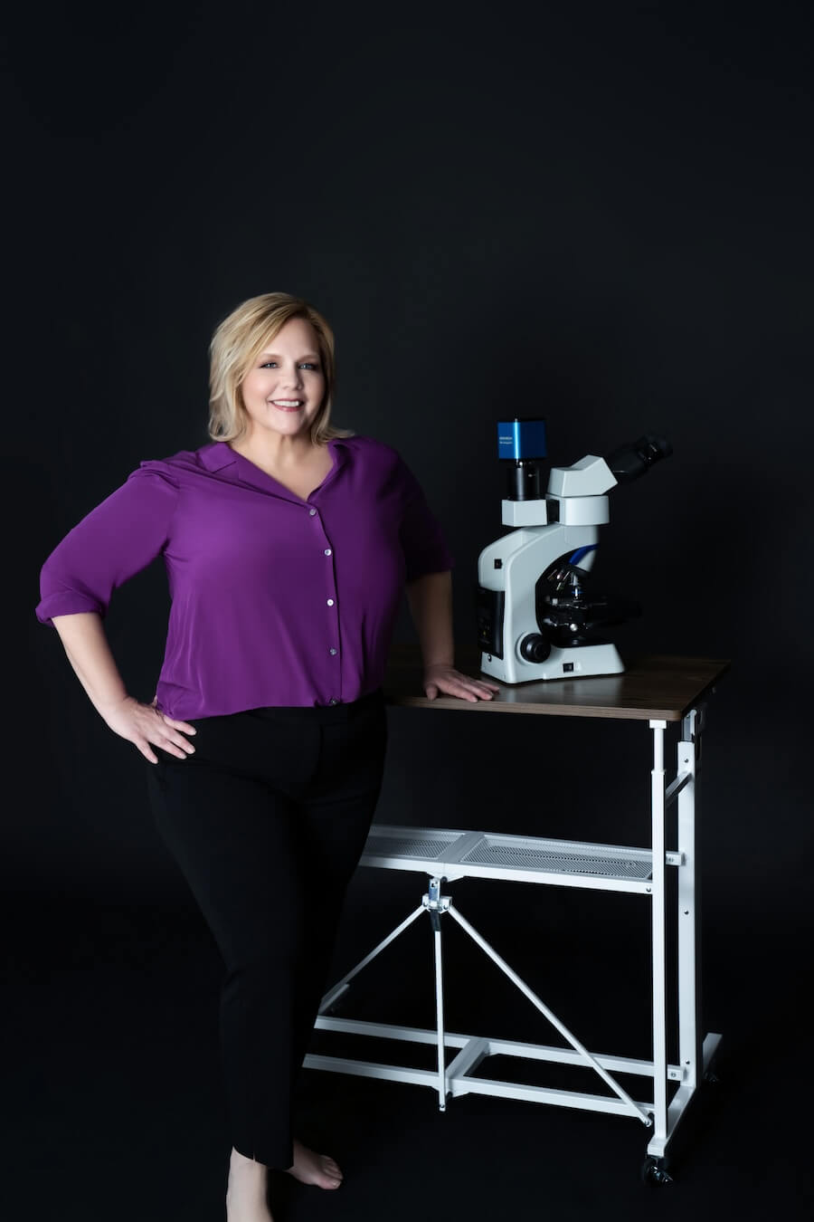 Brandi Stewart working with here microscope